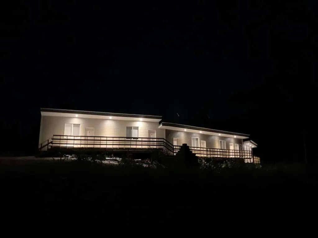 Namushka Lodge building illuminated at night, showing its exterior lights