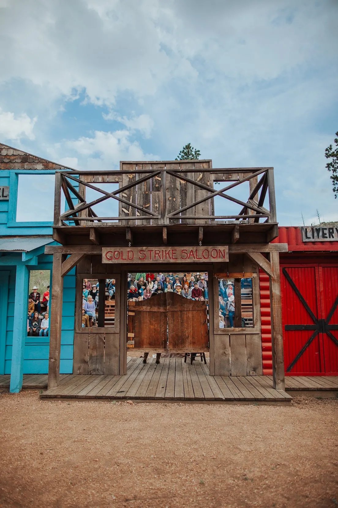 Rustic wooden Gold Strike Saloon building facade with swinging doors