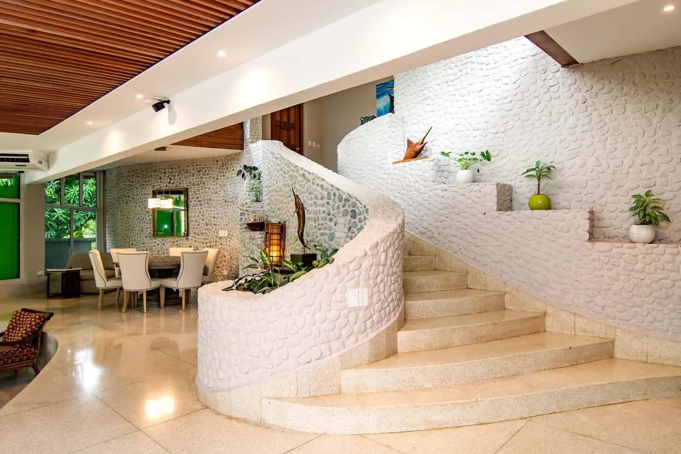 Luxurious lodge interior with a grand spiral staircase and elegant decor