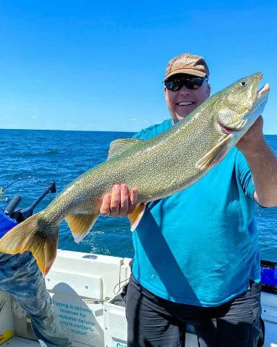 Lake Ontario Angler holds up really nice Laker.