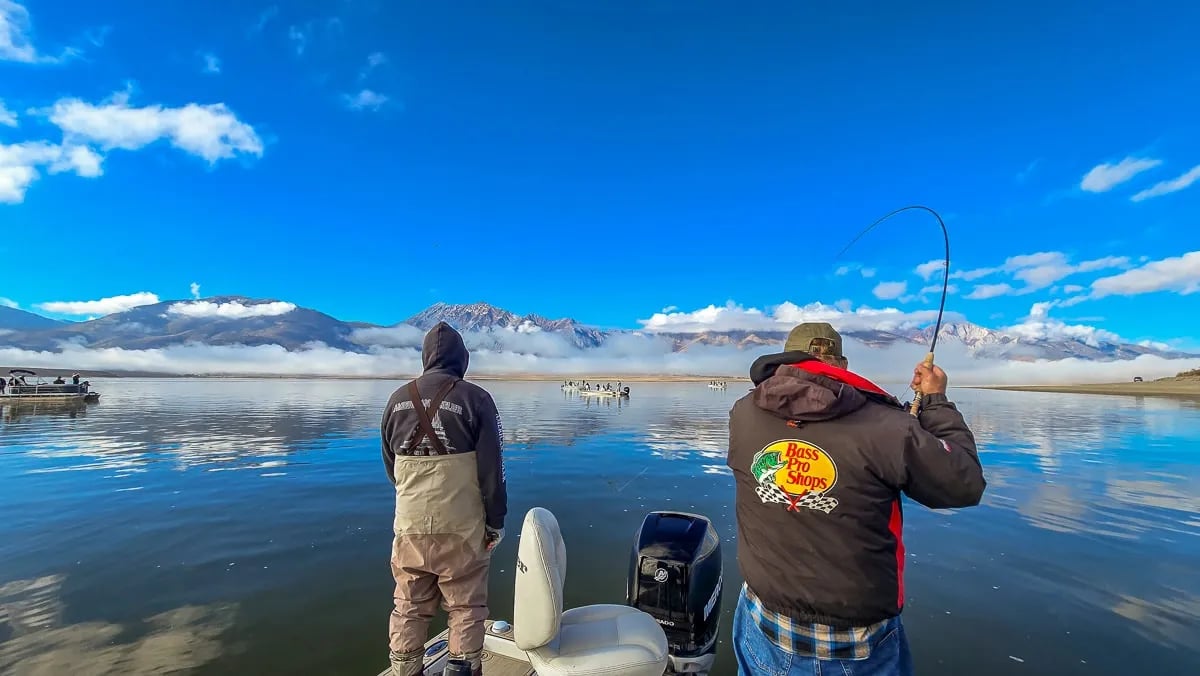 A fly fishermen hooked up to a large trout on Crowley Lake.