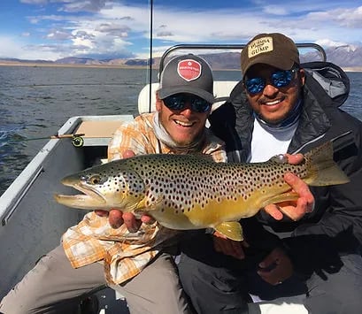 "Crowley Lake fly fishing guide service helping clients catch trophy trout in the Eastern Sierra."