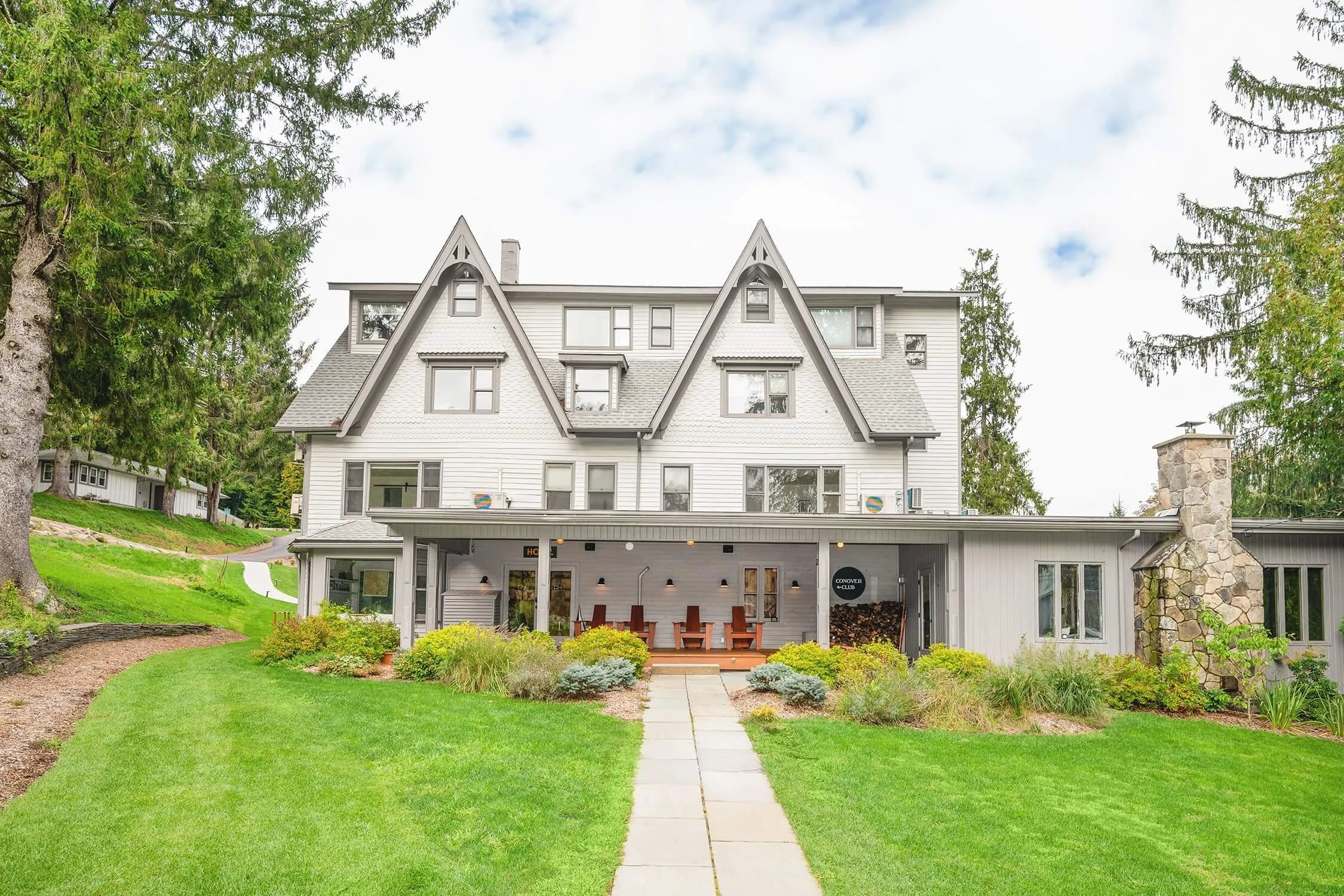 Aerial view of Callicoon Hills property with main lodge, barn, pool, and surrounding autumn forest