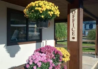 Mums outside the Office of the Upper Delaware Inn