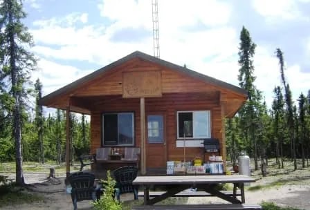 Wolf Lake Outpost cabin with a picnic table and small porch