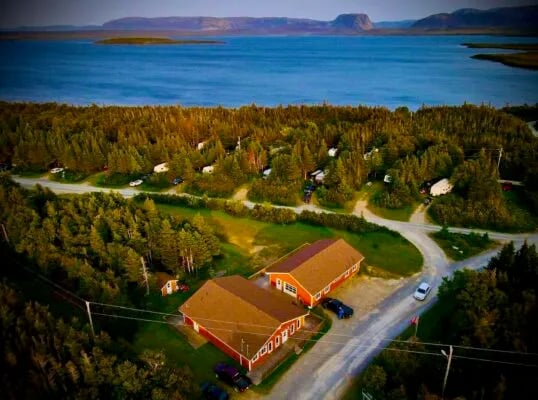 Aerial view of the resort with cabins, RV sites, and lake