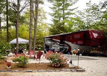 Expansive aerial view of Lake George Escape RV resort with winding rivers and dense forest