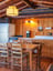 Kitchen with sink, gas stove, and table and chairs for 6 people