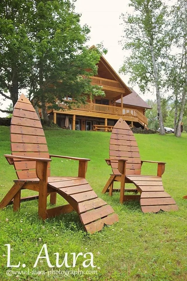 Two chairs in front of Country Haven Lodge designed like wild atlantic salmon